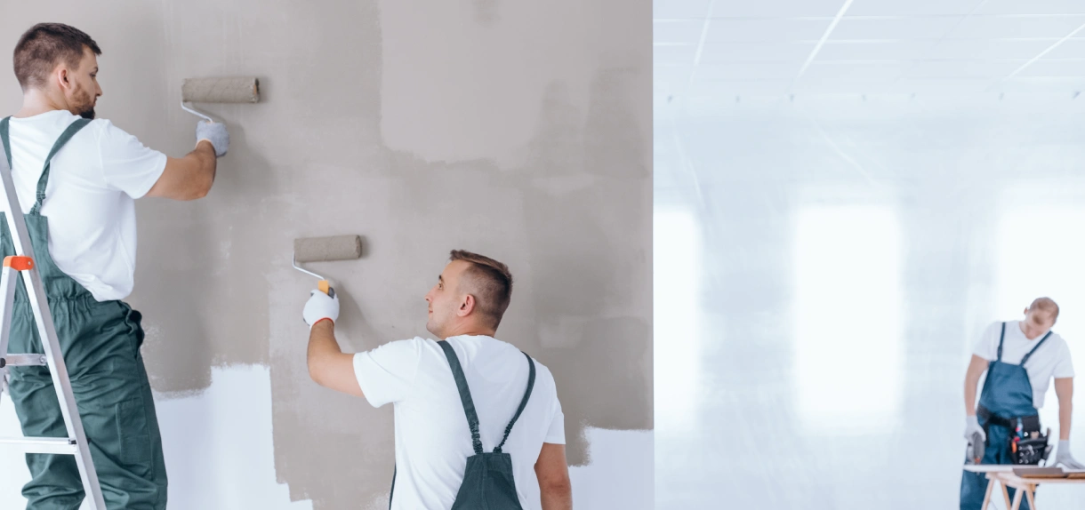 A man in white shirt painting the wall.